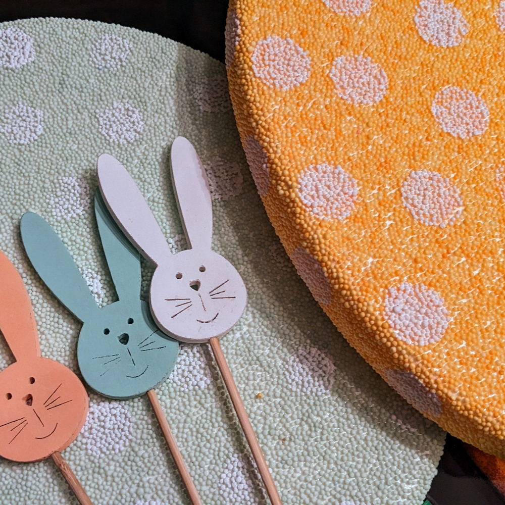 Easter Eggs Two Big And Bold With Polka Dors And Ribbon And Bunnies Made Of Wood